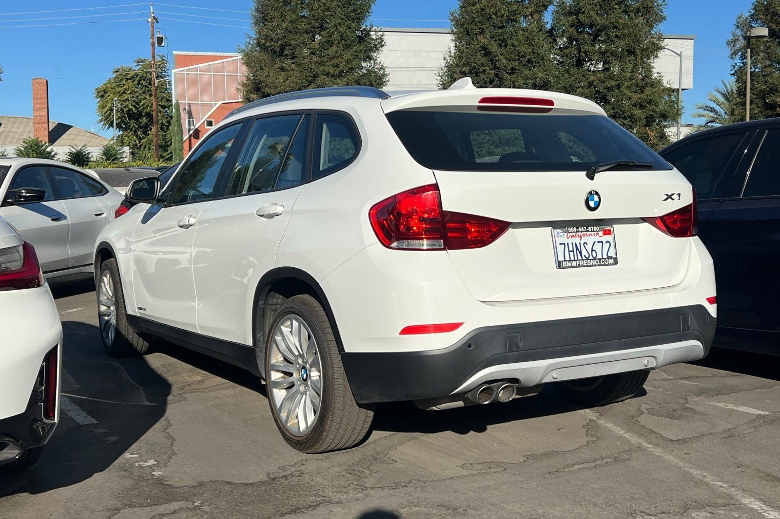 Used 2015 BMW X1 28i with VIN WBAVM1C58FVZ93649 for sale in Fresno, CA