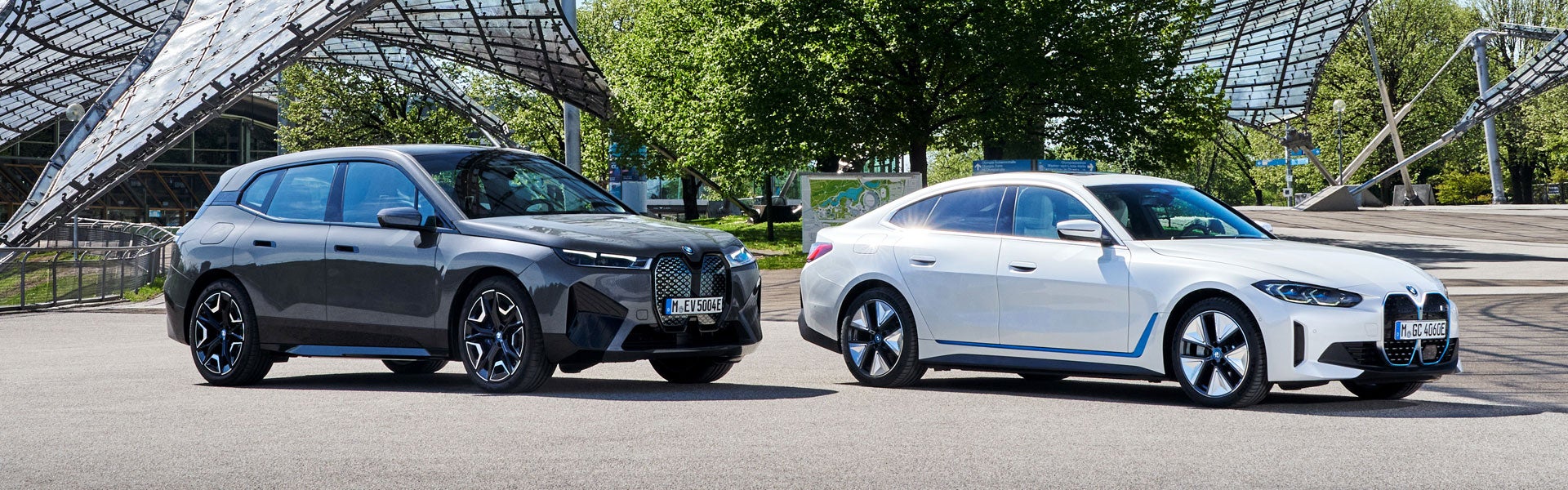 Side-by-side view of BMW iX SAV and BMW i4